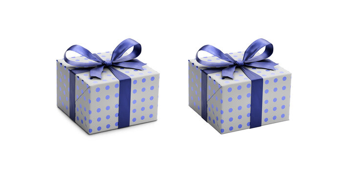 Two white gift wrapped presents with blue metallic spots with navy blue ribbon bows, one with a shadow, one without isolated against a transparent background