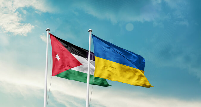 Jordan Ukraine friendship flags are waving in the sky. Two country flag for agreement or deal. Jordan Ukraine national flag for commitment.