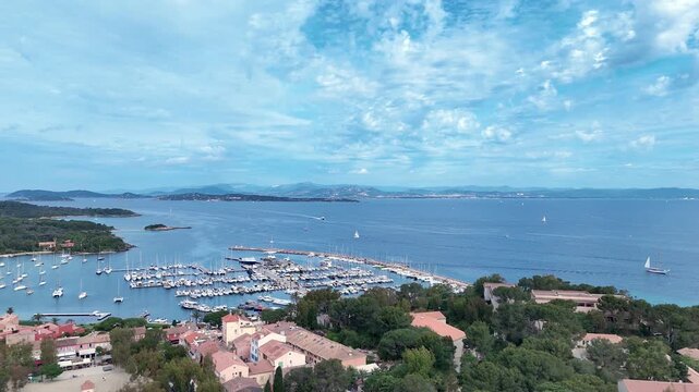 Aerial view of Porquerolles Island port, Provence-Alpes-C&ocirc;te d'Azur, French Riviera, France, Europe. Scenic aerial view of the marina and village of Porquerolles Island on the French Riviera, France, 