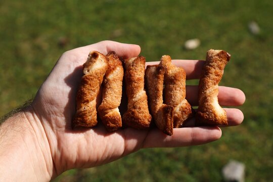 Spanish cookies lazos de hojaldre (puff pastry ties). Confectionery of Spain. Assorted cookies.