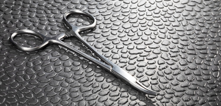 Medical clamp on a textured surface with backlighting