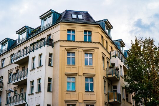 Apartment building with dormer windows and balconies