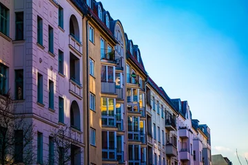 Apartment buildings with balconies and windows © Novanture