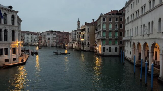 Quiet Venetian Canal at Night with Gondolas and Reflections