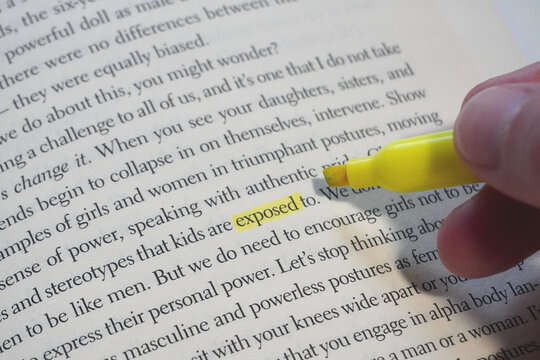 Exposed word highlighted in a book page.