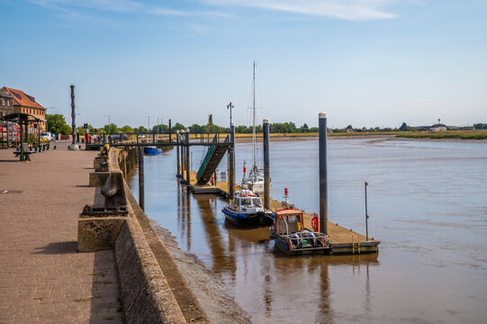 A view of the South Quay and visitor pontoons along the River Great Ouse in King's Lynn, Norfolk, England in summertime