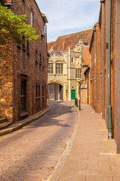 A view at the start of College Lane looking towards the historic Trinity Guildhall in King's Lynn, Norfolk, England in summertime