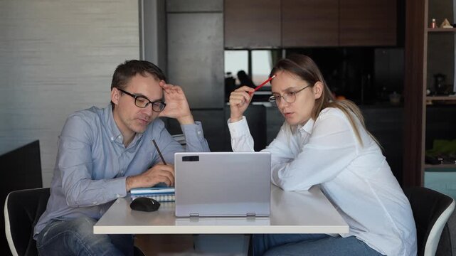 Coworking, couple in office and working together for planning remote work startup strategy online. Small business, man and woman at desk on laptop, networking email and web research at digital agency