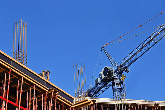 Blue tower crane and construction equipment