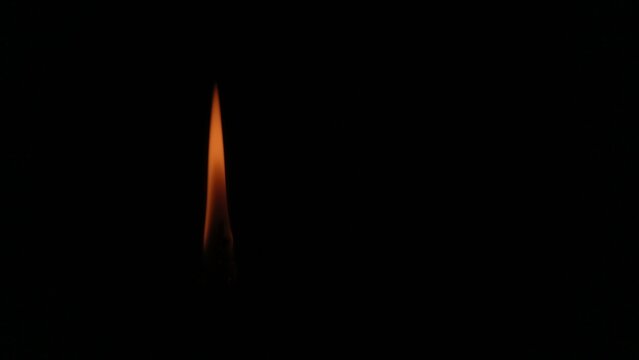 burning match on black