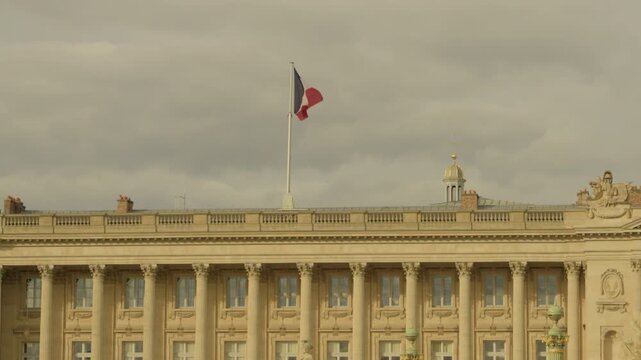 Historic H&ocirc;tel de la Marine with French Flag at Place de la Concorde in Paris, France