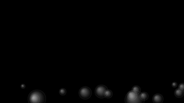 Abstract translucent bubbles rising against a dark black background