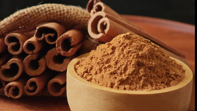 Turmeric powder in a wooden cup