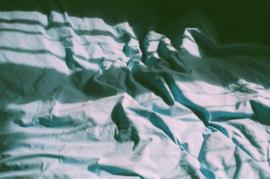 Wrinkled Sheets with Striped Shadows