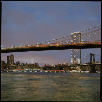 Brooklyn Bridge over East River at blue hour