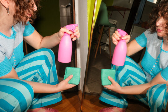 Reaching for Cleaning Spray