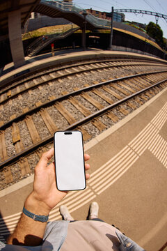 White screen Phone at a Train Station
