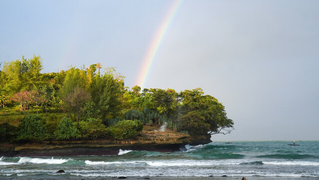 Beautiful Rainbow Over Coastal Cliff and Ocean