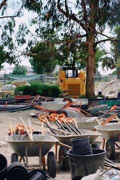 Construction Equipment and Wheelbarrows at a Work Site