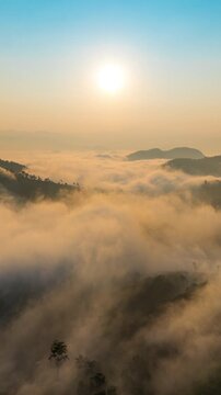 Aerial shots of Golden morning sunlight pierces the fog over mountain, Thailand.