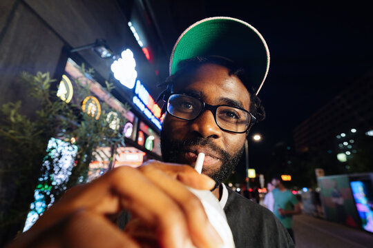 Man With Straw Neon Night