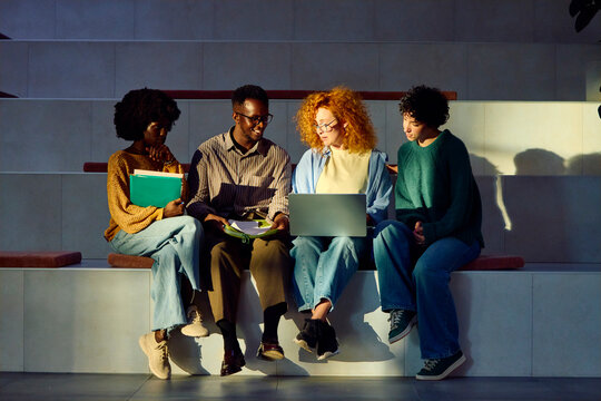 Four Classmates Studying Together
