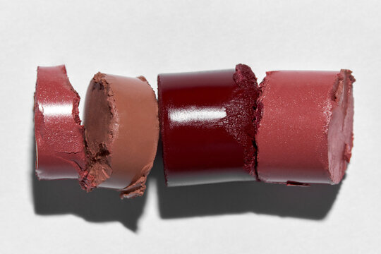 Modern Beauty Composition with Several Imperfect Lipstick Pieces