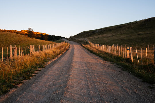 Country Road Winding Over Hills