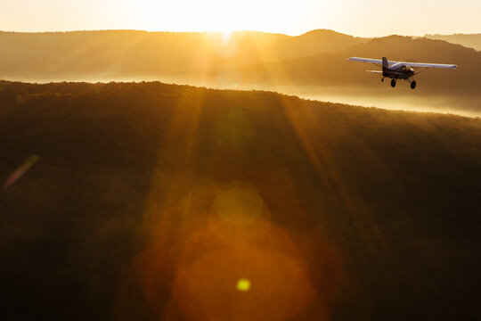 A small plane flies in the sky