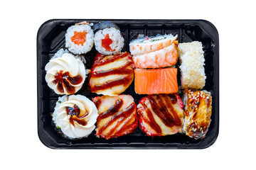 Assorted sushi rolls with salmon, shrimp, sesame, creamy topping and dark savory sauce arranged in a black takeaway tray. PNG cutout on a transparent background, ideal for restaurant menus © PRAPS