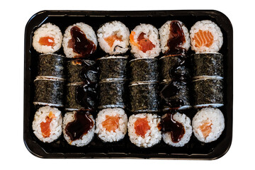 Assorted salmon sushi rolls with rice and nori arranged in a black takeaway tray and topped with dark sauce. PNG cutout on a transparent background, suitable for Japanese food © PRAPS