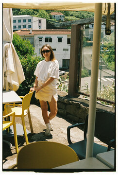 Woman on Sunny Cafe Terrace with Mountain View in Madeira