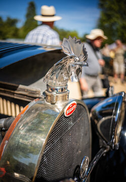 Bugatti Club Germany meeting in Bad Neuenahr, Germany &ndash; August 8, 2026: Close-up of the famous Art Deco crystal hood ornament &ldquo;Rooster&rsquo;s Head (Hahnenkopf, T&ecirc;te de Coq)&rdquo; on a historic Bugatti vehicle.
