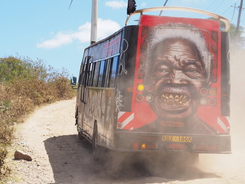 Matatu Minibus Artwork Driving on Unpaved Rural Dirt Road in Kenya
