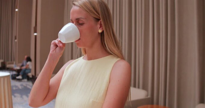 Woman Enjoying Coffee Break in Modern Hotel in Tashkent Uzbekistan