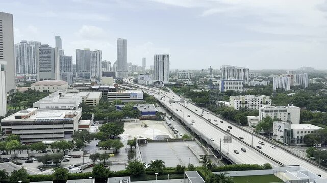 I-95 south bound showing traffic flow in both ways with Miami skyline