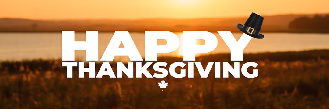 Happy thanksgiving greeting banner with a black pilgrim hat and a white maple leaf on a blurred golden hour autumn landscape background