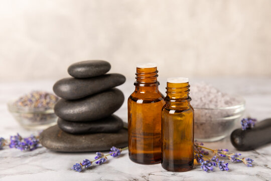 Lavender essential oil in glass and bottles with fresh lavender fowers. Natural aromatherapy. Organic skincare. Herbal cosmetic serum. Spa wellness treatment. Botanical Extract, beauty and self care 