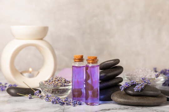 Lavender essential oil in glass and bottles with fresh lavender fowers. Natural aromatherapy. Organic skincare. Herbal cosmetic serum. Spa wellness treatment. Botanical Extract, beauty and self care c