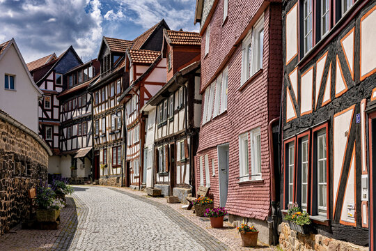 Half-timbered houses line a cobbled street in a picturesque old town: the old town of Alsfeld
