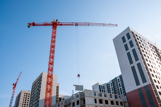 Voronezh, Russia, July 23, 2026: Tower cranes over the construction site of a modern residential complex in Voronezh.