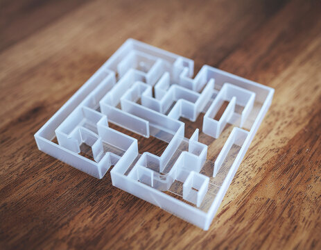 Small white maze model representing strategic problem solving