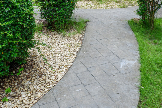 Garden landscape design with pathway in garden and footpath in picturesque summer park and staircase in backyard,Paving stones on floor in park,space for text.