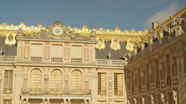 Elegant Baroque Facade of the Palace of Versailles with Golden Decorations in France