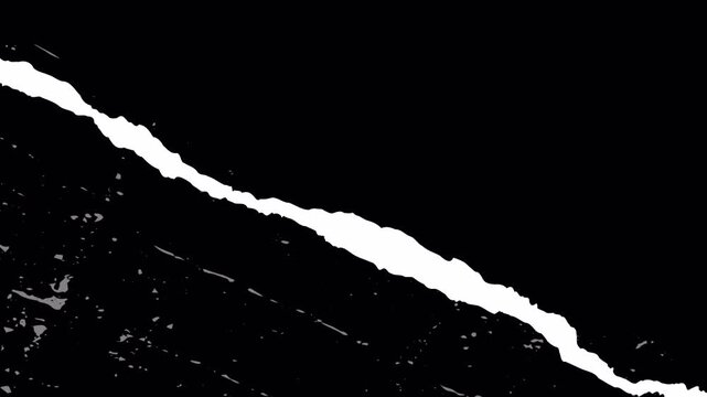 Abstract white diagonal jagged line transition effect on black background.