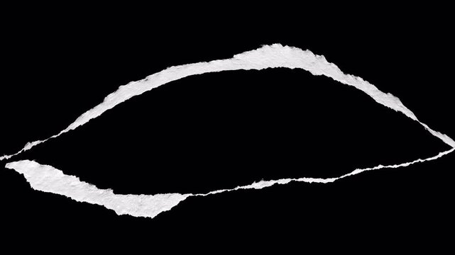 Abstract white paper tear edges on black background transition effect.