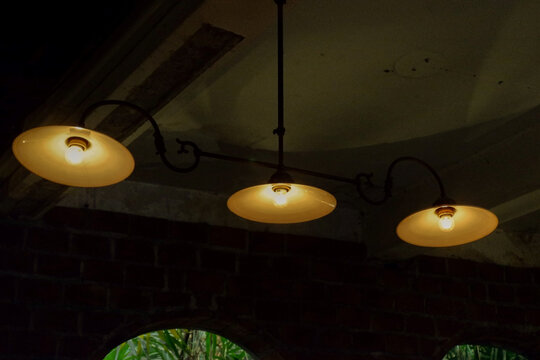 Ceiling light in cafe,red brick wall home,pendant ligh,light bulb,modern and vintage style,apartment or home,house idea design,furnitures,Home decor concept.