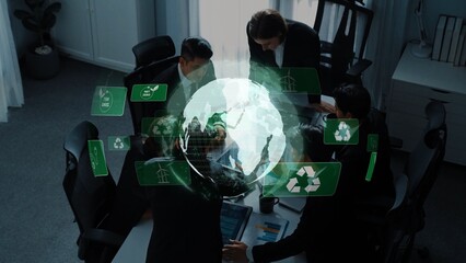 Obraz premium A dynamic business meeting in a modern office setting where professionals discuss sustainable development initiatives, featuring digital elements like a globe and eco-icons. Raster