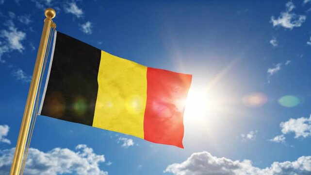 Flag of belgium waving against a clear blue sky with bright sunlight