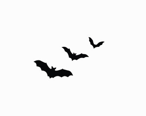 Fototapeta premium Three black bats flying in sky